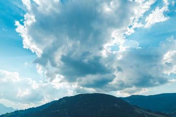 Fototapeta premium clouds over the mountain. Sunset in the Alps. Austria