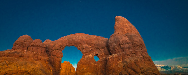 FEBRUARY 15, 2019 -  ARCHES NATIONAL PARK, UTAH , USA - Arches National Park, Utah at dusk features Turret Arch at dusk with first stars © spiritofamerica