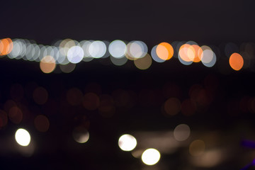 Nightlife concept background. Beautiful night city with colorful bokeh circles.
