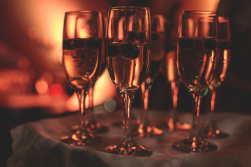 View of alcohol setting on catering banquet table, row line of different colored alcohol cocktails on a party, martini, vodka, and others on decorated catering bouquet table event