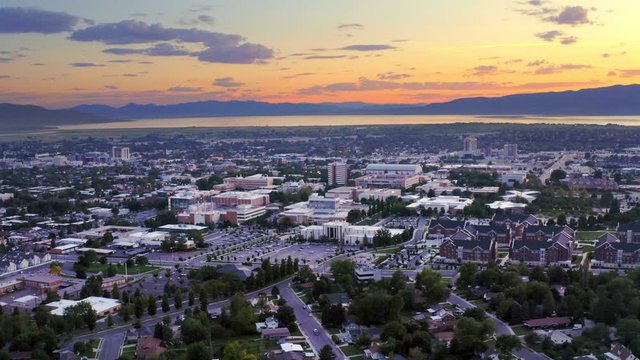 Aerial panorama of BYU Provo campus at sunset dusk 4K