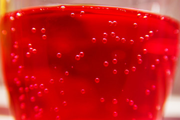 air bubbles in pink liquid close-up