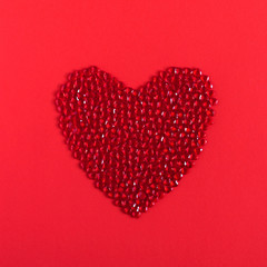 Red heart on red background. Valentine's day background. Flat lay, top view, copy space