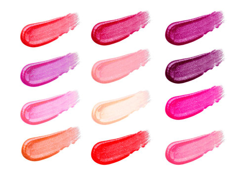 Lip gloss face make-up samples palette. Set of colorful cosmetic liquid lipgloss in different colour smudge smear strokes. Make up smears isolated on a white background. Lipstick colors
