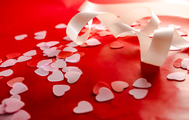 Valentine day concept. Hearts and Ribbon with red background. 