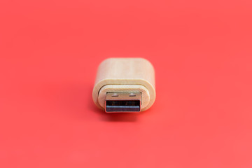 Wooden USB stick on red background