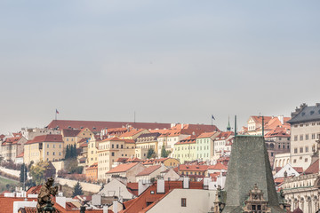 Fototapeta na wymiar Panorama of the Prague Castle (Prazsky Hrad) hill, also called Hradcany, in Czech Republic, seen from the mala strana district, with its typical baroque architecture buildings and and medieval streets