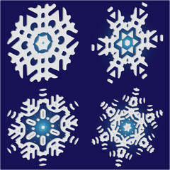 Set of christmas paper snowflakes on blue background.