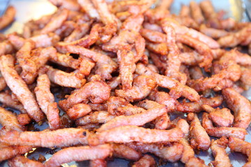 Traditional Thai food at market. Roasted spicy pork