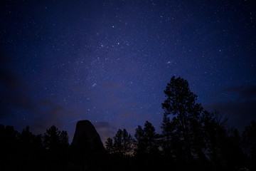 Obraz na płótnie Canvas Starry Night in storm inm Devils Tower National Momument, Wyoming