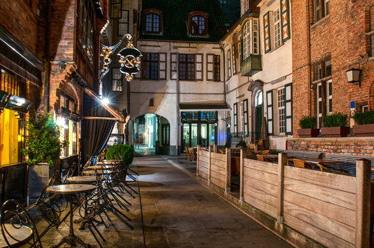 Exterior Of A European Restaurant In The Narrow Street At Night