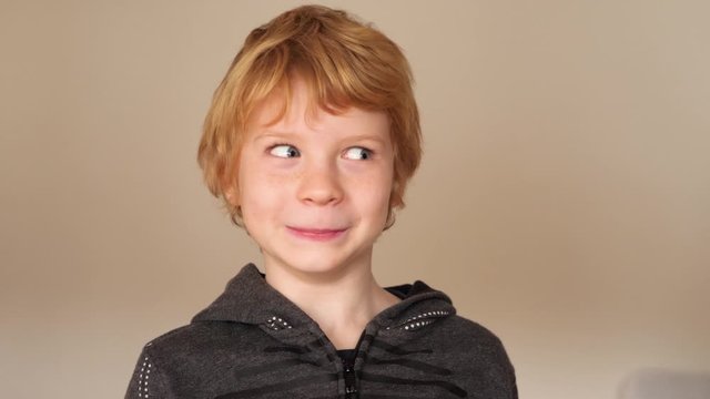 Boy with milk tooth gap laughs wonderfully