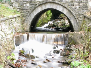 Waterfall under a bridge