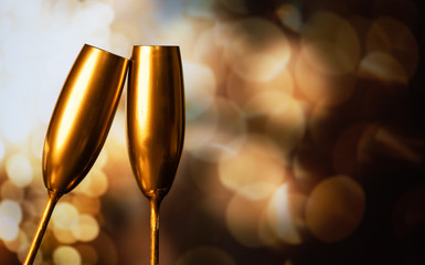 golden champagne glasses and holiday lights