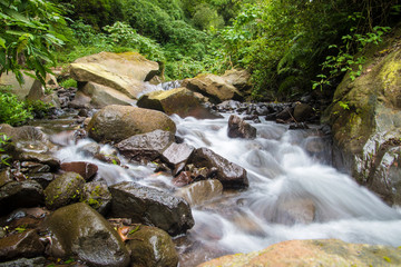 rocky river rafting area small waterfall in the forest in indonesia