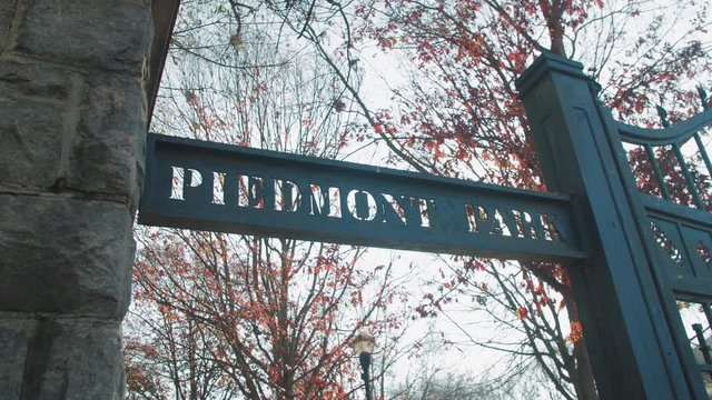 Sun peeks through the green gate in piedmont park in Atlanta, Georgia