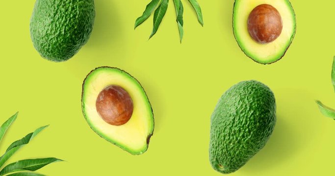 Motion animation with avoAvocado animation on the green background. Top view 4k.