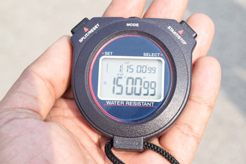 stopwatch in hand
