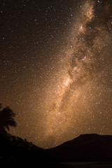 Orange milky way visible on a beach in Fiji