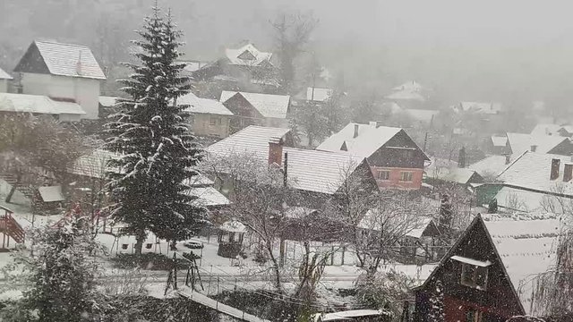 It's snowing in a rural area in Transylvania - Romania