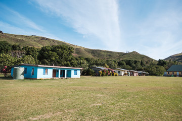 Malakati village, Fiji - 10/27/2019: Colourful church on the grass area in traditional Fijian village during sunny day