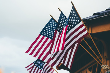 USA flags flying on the side of a gazebo 