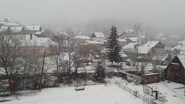 It's snowing in a rural area in Transylvania - Romania
