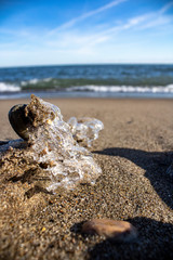 Frozen shapes of rock and sand in the beach in the winter
