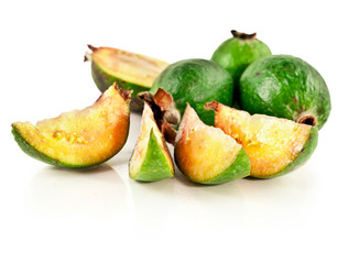 Fresh feijoa fruits (acca sellowiana, pineapple guava) with slices isolated on a white background.
