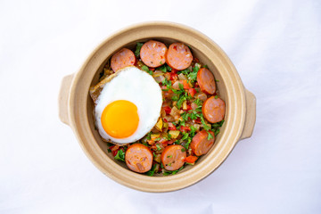 Spanish dish pisto manchego with chorizo sausages and fried egg