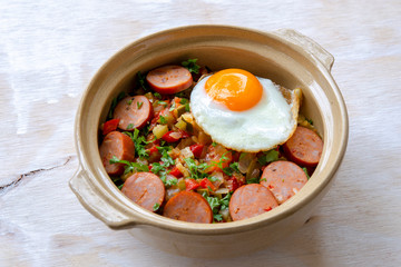 Spanish dish pisto manchego with chorizo sausages and fried egg