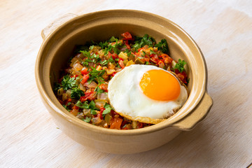 Spanish dish pisto manchego with fried egg