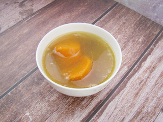 Chinese tableware carrot stew chicken soup on wooden board