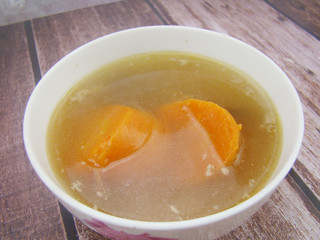 Chinese tableware carrot stew chicken soup on wooden board