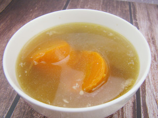 Chinese tableware carrot stew chicken soup on wooden board