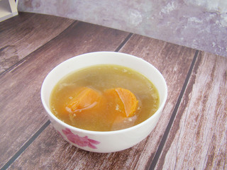 Chinese tableware carrot stew chicken soup on wooden board