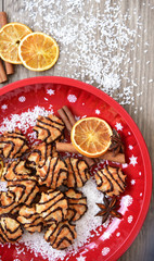 Coconut and Dark Chocolate cookies for Christmas Party with red tray and Christmas Decoration