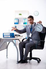 Young male accountant working in the office