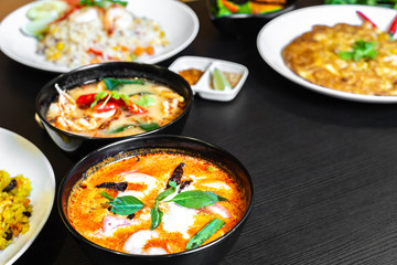 Authentic Tom Yum Soup or Tom Yam Kung, a traditional hot spicy sour soup, typical dishes in Thailand, usually cooked with shrimps.