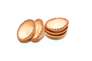 Empty tartlets on a white background for a festive buffet reception. The concept of cooking.