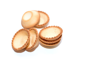 Empty tartlets on a white background for a festive buffet reception. The concept of cooking.