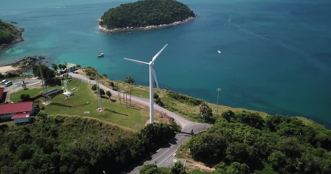 Windmill with Andaman sea on the background at nai harn in Phuket thailand