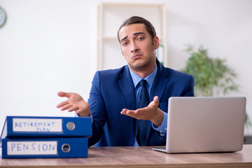 Young male accountant working in the office