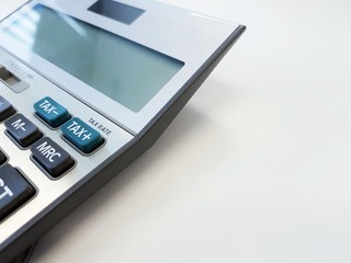 Blurred selective focus, men hand calculating on financial cost reduction , tax and business with coin, money and pencil. Tax and expense cost saving for personal and enterprise. white background