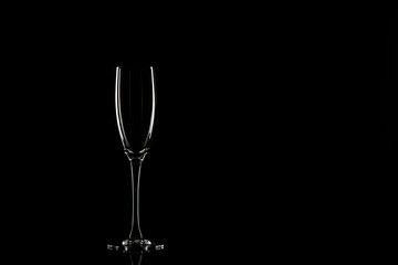 Empty champagne glasses on a black background