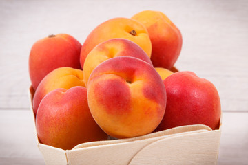 Fresh peach in container. Healthy dessert as source minerals and vitamins
