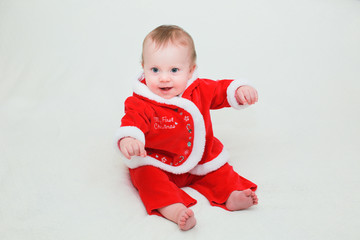 Close up Portrait of Cute Little 8 Month Old Baby Girl  with Big Blue Eyes, in Santa Claus Outfit, Happy and Healthy Baby, Santa Baby