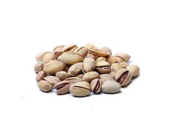 a pile of pistachio nuts isolated on white background. Horizontsl image
