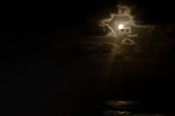 Full moon with reflection over the sea