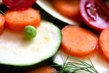 different fresh chopped vegetables with zucchini carrots and tomato
